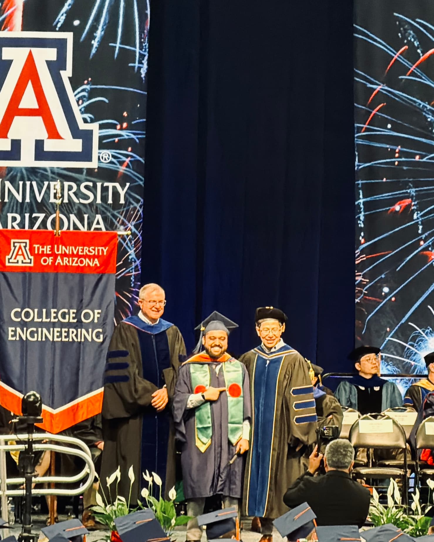 Arfan Uddin crossing the stage at the University of Arizona College of Engineering commencement