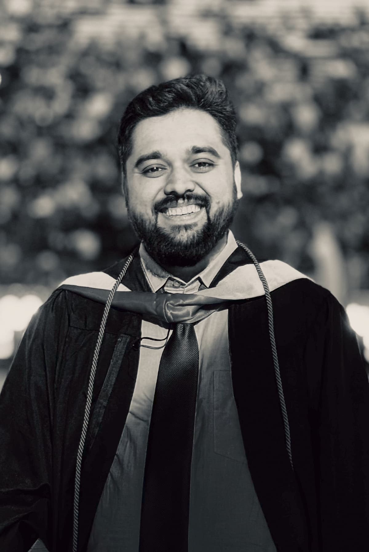 Arfan Uddin in cap and gown on graduation day
